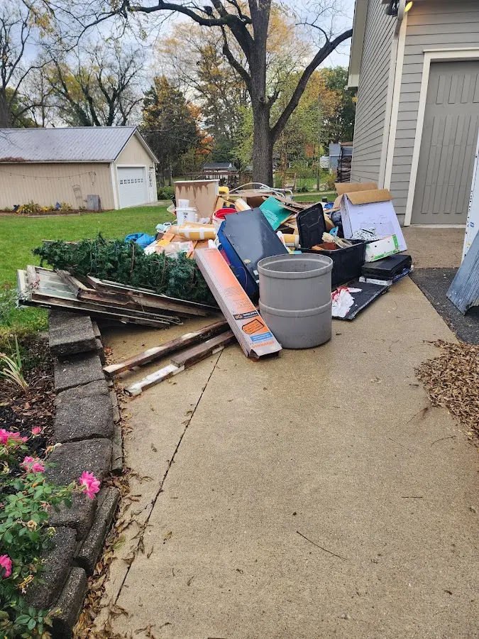 Dumpster being loaded with debris for Residential Dumpster Rental in Mount Olive